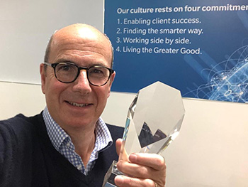 Chris Lay, CEO, holding award
