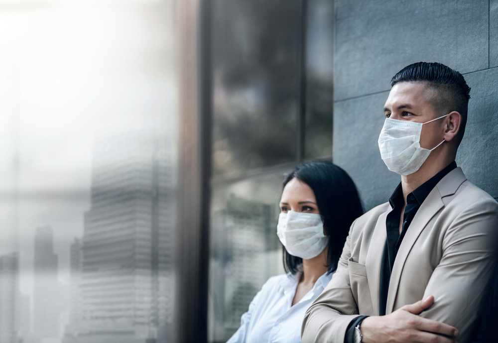 Covid-19 or Corona Virus Situation in Business Concept. Business People with Surgical Safety Mask standing at Office Urban Building. Team Employees or Owner Protected and take Care of their Health; Shutterstock ID 1681142671; Other: ; Purchase Order: 123; Client/Licensee: ; Job: 