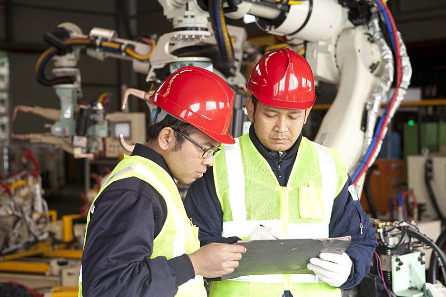 Two manufacture worker discussing in factory; Shutterstock ID 174605396; PO: 123